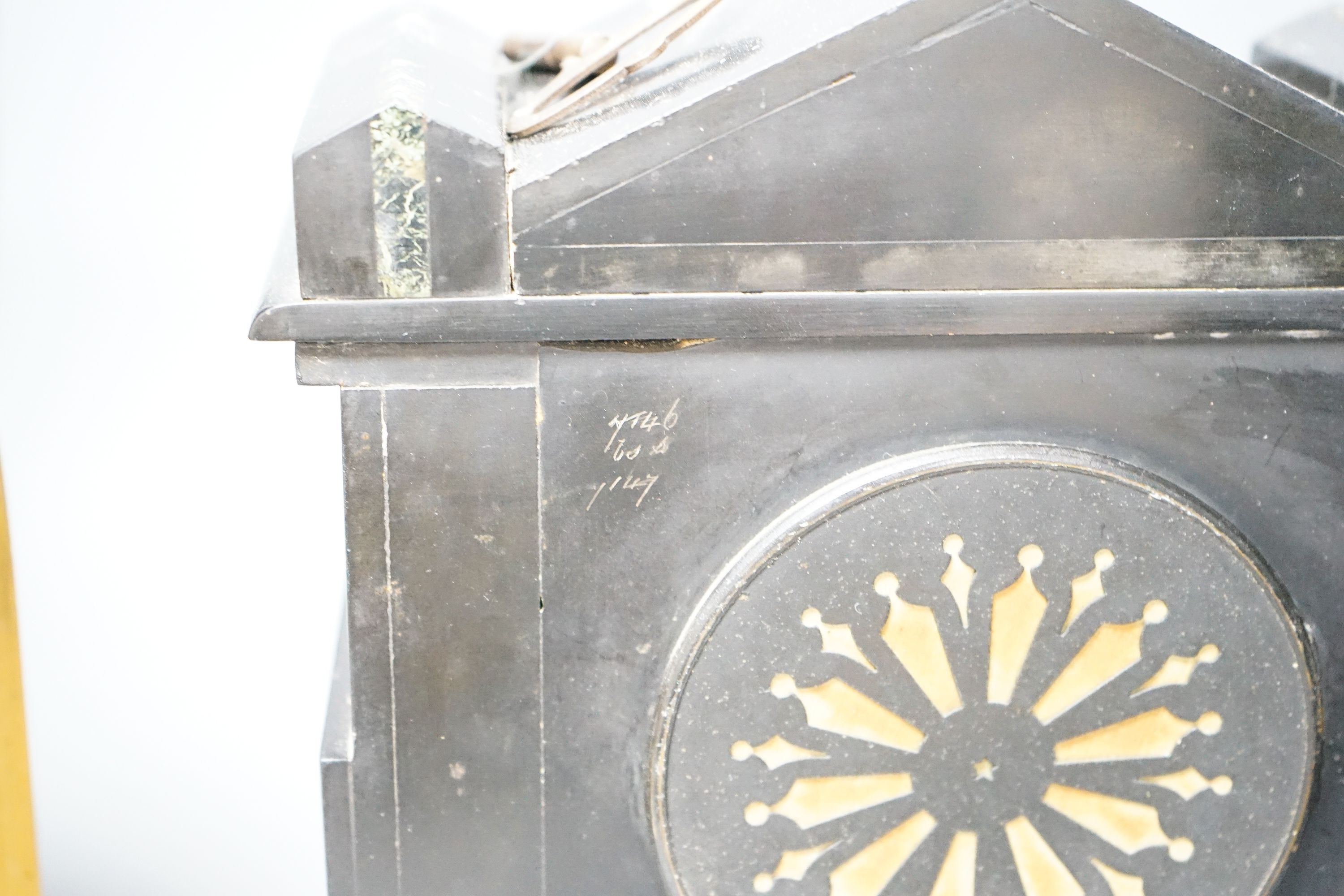 A Victorian slate clock and a 1930's arched clock